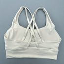 Top esportivo feminino de cor sólida com costas cruzadas macias, ideal para fitness, ioga e outras atividades físicas. Reforço de alta resistência e à prova de choque. Possui bojo para os seios.