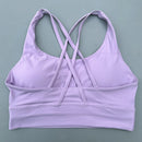Top esportivo feminino de cor sólida com costas cruzadas macias, ideal para fitness, ioga e outras atividades físicas. Reforço de alta resistência e à prova de choque. Possui bojo para os seios.