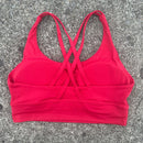 Top esportivo feminino de cor sólida com costas cruzadas macias, ideal para fitness, ioga e outras atividades físicas. Reforço de alta resistência e à prova de choque. Possui bojo para os seios.