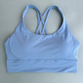 Top esportivo feminino de cor sólida com costas cruzadas macias, ideal para fitness, ioga e outras atividades físicas. Reforço de alta resistência e à prova de choque. Possui bojo para os seios.