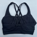 Top esportivo feminino de cor sólida com costas cruzadas macias, ideal para fitness, ioga e outras atividades físicas. Reforço de alta resistência e à prova de choque. Possui bojo para os seios.