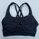 Top esportivo feminino de cor sólida com costas cruzadas macias, ideal para fitness, ioga e outras atividades físicas. Reforço de alta resistência e à prova de choque. Possui bojo para os seios.