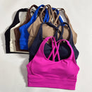 Top esportivo feminino de cor sólida com costas cruzadas macias, ideal para fitness, ioga e outras atividades físicas. Reforço de alta resistência e à prova de choque. Possui bojo para os seios.
