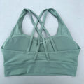 Top esportivo feminino de cor sólida com costas cruzadas macias, ideal para fitness, ioga e outras atividades físicas. Reforço de alta resistência e à prova de choque. Possui bojo para os seios.