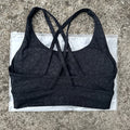 Top esportivo feminino de cor sólida com costas cruzadas macias, ideal para fitness, ioga e outras atividades físicas. Reforço de alta resistência e à prova de choque. Possui bojo para os seios.